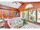 Comfortable sunroom with wood paneling, vaulted ceilings, jacuzzi access and lots of natural light at 160 Quail Hollow Dr, Kings Mountain, NC 28086