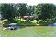 Picturesque waterfront property with a private boat dock, spacious lawn, and a charming deck, ideal for lake living at 160 Quail Hollow Dr, Kings Mountain, NC 28086