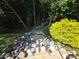 The backyard features natural stairs built of stone, native plantings, and privacy at 16115 Commodore Dr, Lancaster, SC 29720