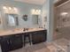 Modern bathroom featuring double sinks, vanity, and tiled shower at 16115 Commodore Dr, Lancaster, SC 29720
