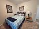 Cozy bedroom with neutral carpet, natural light, and classic decor at 16115 Commodore Dr, Lancaster, SC 29720