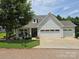 Charming single-Gathering home with well-maintained lawn and three-car garage at 16115 Commodore Dr, Lancaster, SC 29720