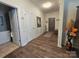 Open hallway featuring wood floors, white trim, and access to other rooms at 16115 Commodore Dr, Lancaster, SC 29720
