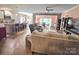Living room features hardwood floors, a ceiling fan, and comfortable seating at 16115 Commodore Dr, Lancaster, SC 29720