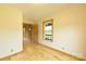 Bright bedroom featuring natural wood flooring and a rustic wood door, offering a cozy retreat at 1640 Bear Poplar Rd, Cleveland, NC 27013