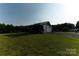 Charming home on large property, featuring a welcoming porch and a mix of siding and wood trim at 1640 Bear Poplar Rd, Cleveland, NC 27013