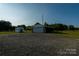 Detached garage with covered parking offers ample space for vehicles and outdoor gear storage at 1640 Bear Poplar Rd, Cleveland, NC 27013