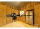 Well-equipped kitchen boasts stainless steel appliances, custom cabinets, and ample counter space at 1640 Bear Poplar Rd, Cleveland, NC 27013