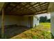 Outdoor storage with open garage offers space for lawn care, and property maintenance at 1640 Bear Poplar Rd, Cleveland, NC 27013