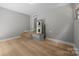 Finished basement featuring durable flooring and a dedicated area for utilities, plus convenient access to upper levels at 1709 Masonic Dr, Charlotte, NC 28205