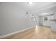 The living room features light gray walls, white trim, wood-look flooring, and an open floor plan at 1709 Masonic Dr, Charlotte, NC 28205
