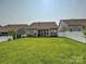Well-maintained backyard with a lush lawn, perfect for outdoor activities and relaxation at 177 Yellow Birch Loop, Mooresville, NC 28117
