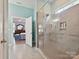 Modern bathroom with a walk-in glass shower and neutral tile at 177 Yellow Birch Loop, Mooresville, NC 28117