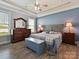 Comfortable bedroom with a tray ceiling, neutral colors, and coordinated furnishings at 177 Yellow Birch Loop, Mooresville, NC 28117