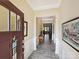 Bright foyer with wood floors and decorative wainscoting at 177 Yellow Birch Loop, Mooresville, NC 28117