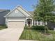 Charming home with a well-manicured lawn, two-car garage and inviting front porch at 177 Yellow Birch Loop, Mooresville, NC 28117