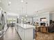 Open kitchen overlooking living spaces with an island and stainless appliances at 177 Yellow Birch Loop, Mooresville, NC 28117
