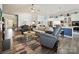 Open-concept living area showcasing comfortable seating, dining area, and access to the kitchen at 177 Yellow Birch Loop, Mooresville, NC 28117