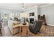 Inviting living room with a fireplace, large windows, and ample seating at 177 Yellow Birch Loop, Mooresville, NC 28117