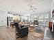 Bright living room with ample seating, fireplace, and open access to kitchen at 177 Yellow Birch Loop, Mooresville, NC 28117
