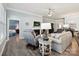 Cozy living room with a fireplace, comfortable seating, and seamless flow to other spaces at 177 Yellow Birch Loop, Mooresville, NC 28117