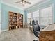 Bright office space with natural light, built-in bookcase, and comfortable seating, perfect for working from home at 177 Yellow Birch Loop, Mooresville, NC 28117