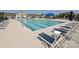 Community pool with lounge chairs and umbrellas, offering a relaxing outdoor experience at 177 Yellow Birch Loop, Mooresville, NC 28117