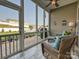 Relaxing sunroom with wicker furniture, a ceiling fan, and views of the fenced backyard and patio at 177 Yellow Birch Loop, Mooresville, NC 28117