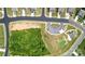 Aerial view of neighborhood greenspace featuring tennis and parking at 2009 Trindle Vine Ln, Waxhaw, NC 28173