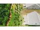 Aerial view shows a fenced backyard, landscaping and proximity to a wooded natural area at 2009 Trindle Vine Ln, Waxhaw, NC 28173