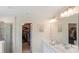 Well-lit bathroom with dual sinks, shower, and walk-in closet with lots of storage space at 2009 Trindle Vine Ln, Waxhaw, NC 28173