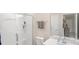 Bathroom with walk-in shower and modern sink design, featuring neutral paint and bright lighting at 2009 Trindle Vine Ln, Waxhaw, NC 28173