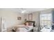 Bedroom with ceiling fan and natural light from a window and decor at 2009 Trindle Vine Ln, Waxhaw, NC 28173