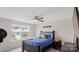 Cozy bedroom with large window providing natural light, and ceiling fan at 2009 Trindle Vine Ln, Waxhaw, NC 28173