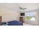Bedroom with ceiling fan and lots of natural light from large window at 2009 Trindle Vine Ln, Waxhaw, NC 28173
