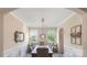 Traditional dining room with wainscoting, a large table, and natural light at 2009 Trindle Vine Ln, Waxhaw, NC 28173