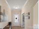 Bright foyer featuring wood floors, neutral walls, and decorative art at 2009 Trindle Vine Ln, Waxhaw, NC 28173