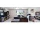 Spacious living room featuring sectional seating, entertainment center, and a ceiling fan at 2009 Trindle Vine Ln, Waxhaw, NC 28173