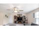Upstairs living room with ceiling fan and built-in shelving and entertainment center at 2009 Trindle Vine Ln, Waxhaw, NC 28173