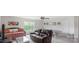 Spacious living room with neutral paint and modern design, featuring a ping pong table and large windows at 2009 Trindle Vine Ln, Waxhaw, NC 28173