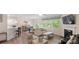 Open-concept living area featuring natural light, a fireplace, and stylish furniture at 2009 Trindle Vine Ln, Waxhaw, NC 28173