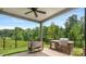 Outdoor grill area with seating and landscaped yard, perfect for outdoor cooking and entertaining at 2009 Trindle Vine Ln, Waxhaw, NC 28173