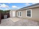 Backyard featuring a concrete patio, white french doors, privacy fence, and gravel bed at 2045 Pin Oak Pl, Cramerton, NC 28032