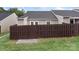 Backyard featuring a privacy fence, concrete patio, white french doors, and gravel bed at 2045 Pin Oak Pl, Cramerton, NC 28032