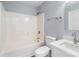 Well-lit bathroom featuring a shower-tub combo and a vanity with a white countertop at 2045 Pin Oak Pl, Cramerton, NC 28032