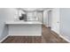 Bright, modern kitchen featuring white cabinets, stainless steel appliances, and a breakfast bar at 2045 Pin Oak Pl, Cramerton, NC 28032