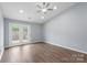 Bright living room featuring wood-look floors, recessed lighting, and a ceiling fan at 2045 Pin Oak Pl, Cramerton, NC 28032