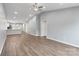 Open-concept living room with wood-look floors that connect to the kitchen at 2045 Pin Oak Pl, Cramerton, NC 28032