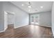 Sunlit living room featuring wood-look floors, recessed lighting, and french doors at 2045 Pin Oak Pl, Cramerton, NC 28032