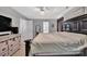 A primary bedroom featuring a large bed with rustic decor and natural light from windows at 210 Clove Hitch Dr, Salisbury, NC 28677
